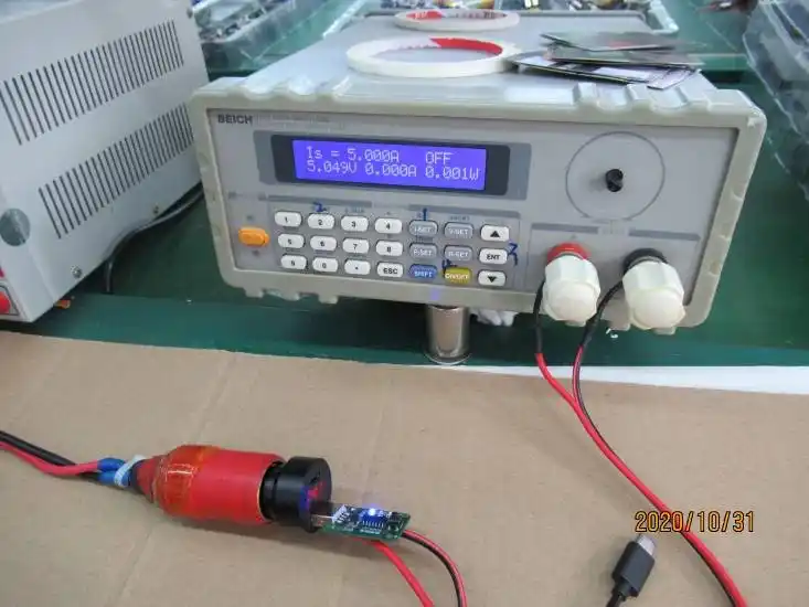 FCC Part 15B compliance testing: PD 3.1 charger output voltage and current measurement on Keysight multimeter during OEM certification testing